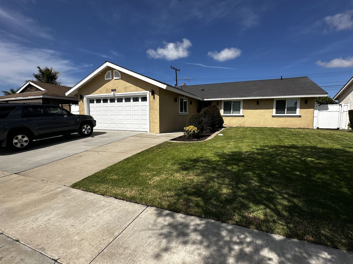 Front Exterior – Garage & Lawn