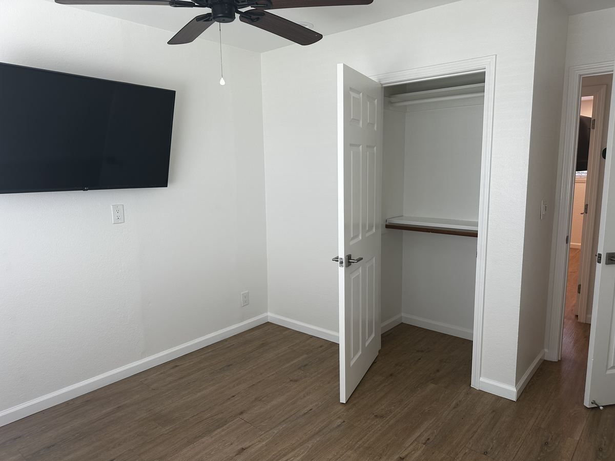 Bedroom B – Open Closet & TV