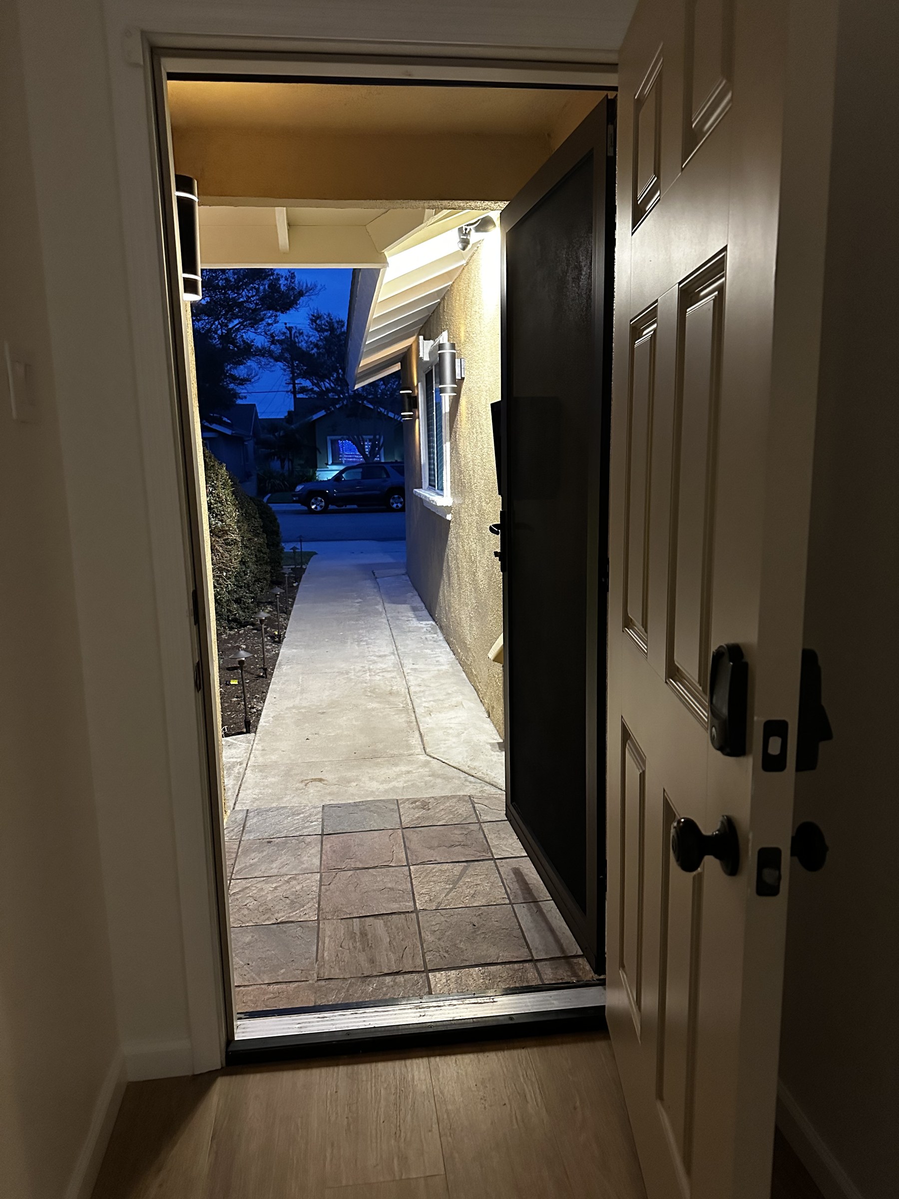 Front Door Open – Side Walkway at Night